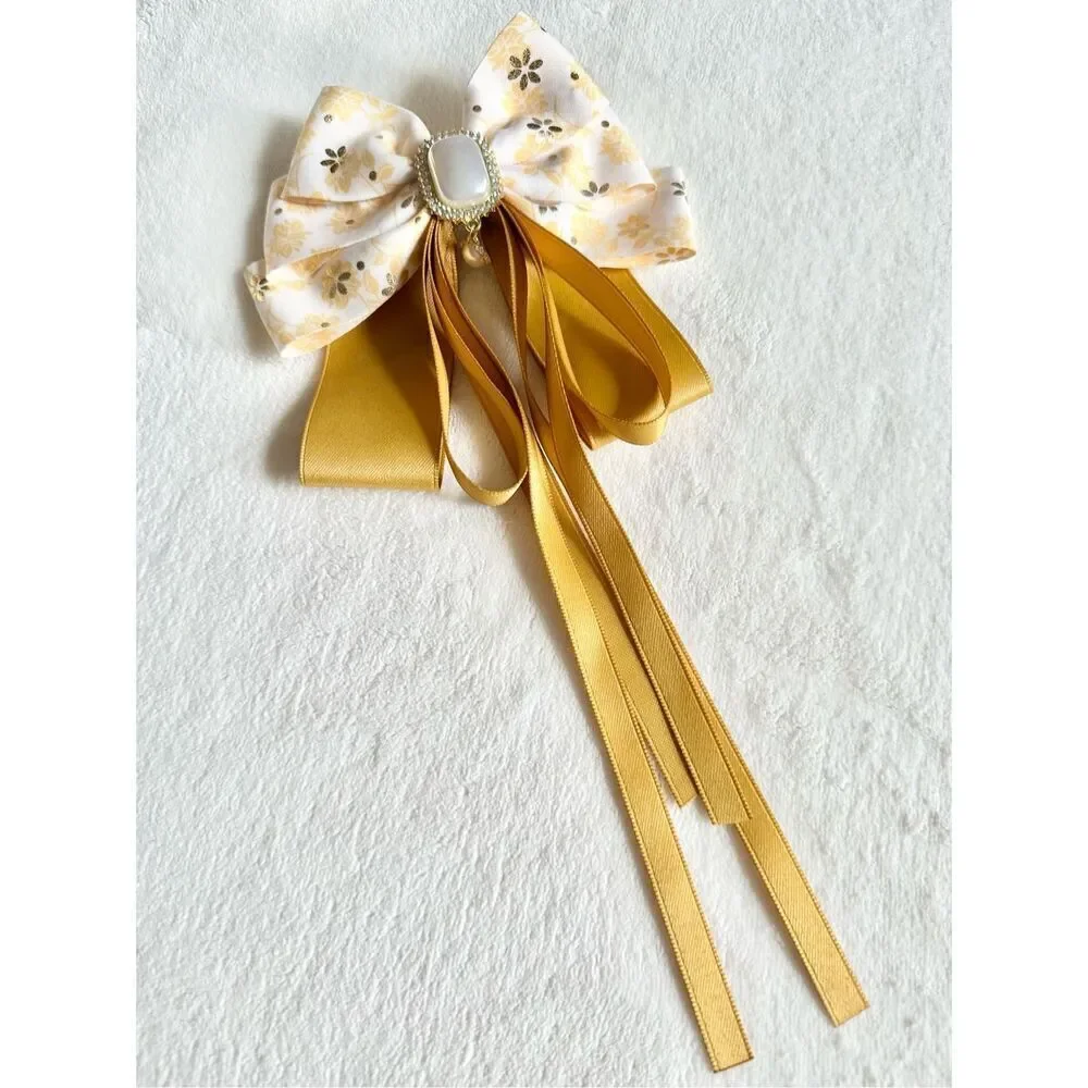 Adorable floral yellow hair bow with floral and pearl accents with hair Barrette
